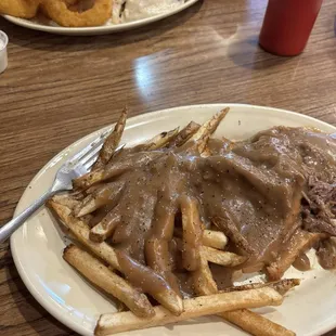 Open Faced Roast beef, foreground.  Chicken fried chicken sammich in the back ground.