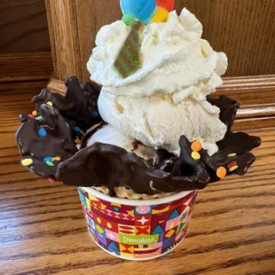 Adventure is Out There! Sundae inspired by “Up” - Vanilla ice cream, hot fudge, whipped cream, and a candied balloon in a waffle cup