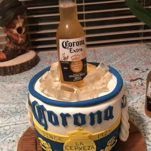 a cake with a bottle of corona beer