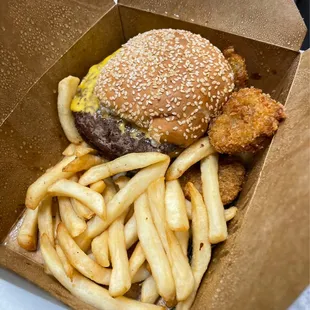 a hamburger and fries in a box