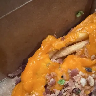 Loaded cheese Loaded Fries with (American) and Cheddar is advertised. Terrible service