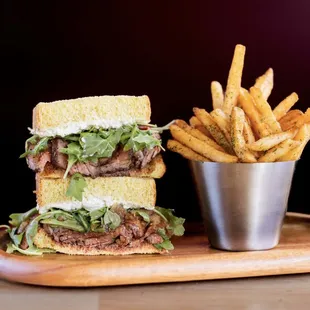BBQ Tri-Tip Steak Sandwich - Brandt tri-tip, Point Reyes blue cheese, caramelized onions, sourdough, herb fries