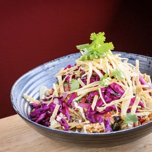 Southwest Bowl - black beans, spanish rice, roasted corn, peppers, avocado crema, red cabbage escabeche, pico de gallo, tortilla strip (GF)