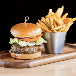 The Whole 9 Yards Burger - 1/2lb Brandt beef patty stuffed with Central Coast Creamery cheddar, pickles, lettuce, tomato, onion, black garli