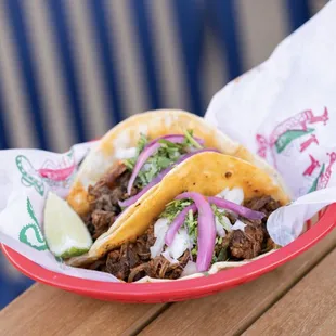 Beef Birria Tacos - Chili pasilla-braised short rib, beef consommé dipping sauce, pickled red onions, chili de arbol (GF)