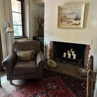 Office area, very quaint, nice place to relax with a fireplace.