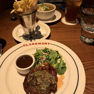 Filet with fries and tortilla soup in the background
