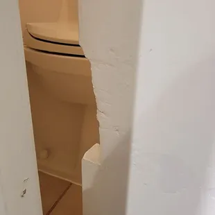 Second picture of the hole in the bathroom door.