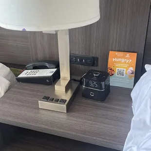 Charging station between beds