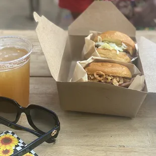 a pair of sunglasses and a drink