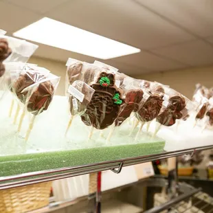 a row of chocolate covered lollipops