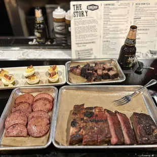 Deviled eggs, 1/2 lb of burnt ends, 1/2 lb of smoked bologna, and a half rack of Ribs. Don't forget the Modelo!