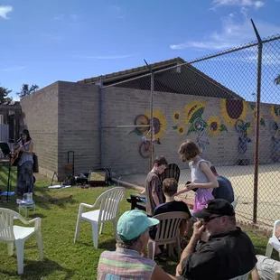 a group of people sitting outside