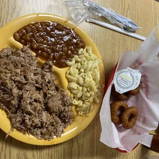 Barbecue plate (barbecue, Mac and cheese, baked beans and Hush Puppies with Honey butter-YES, those are puppies looking like onions.)
