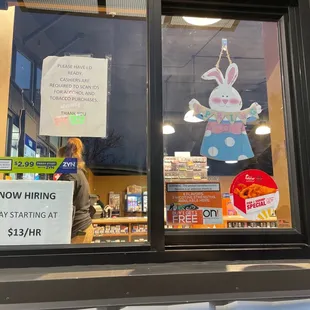 ows a sign in the window