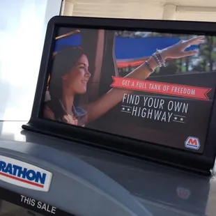 ows an advertisement for a gas station