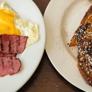 two plates of breakfast food