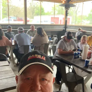 a man sitting at a table in a restaurant