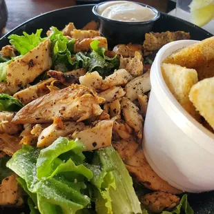 This was supposed to be a Caesar Salad. Rather it is green leaf lettuce with no parmasean cheese and grilled chicken.