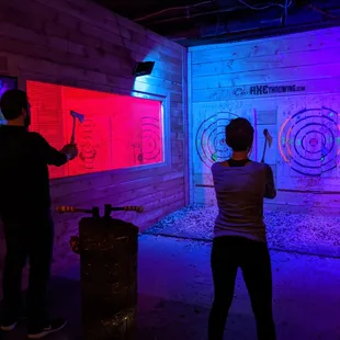 Two people throwing.