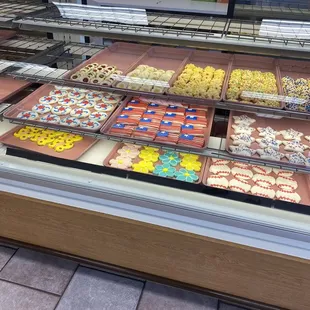 a variety of pastries in a display case