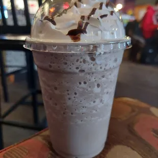 a milkshake with whipped cream and chocolate