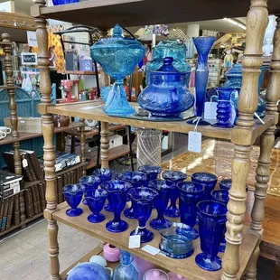 I love color coordinated glass displays! So pretty!