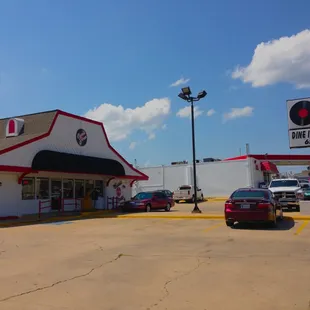 a car parked in front of a classic diner