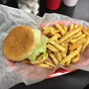 a hamburger and fries in a basket