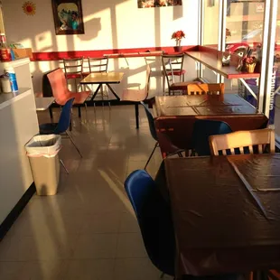 empty tables and chairs in a restaurant