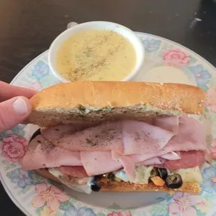 Muffaletta with broccoli cheese soup. It&apos;s wonderful