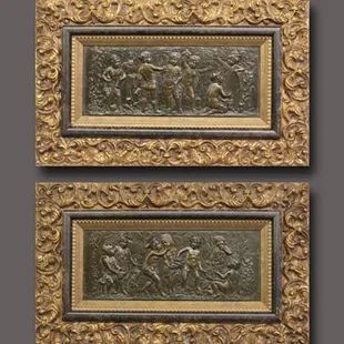 A double frame accentuates the beauty of these antique bronze plates.