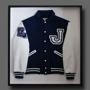 Have an awards jacket hanging unworn in your closet? Let's put it in a frame and hang it on a wall!