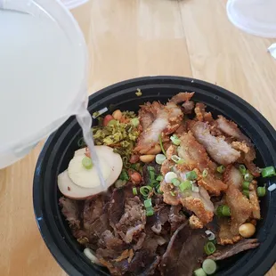 1. Smell, 2. Mix, 3. Taste, 4. Add some soup! So delicious! Crispy pork and marinated beef guilin noodles!