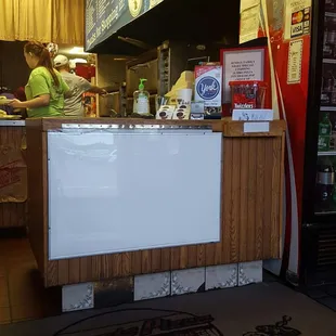 a woman preparing food in a restaurant