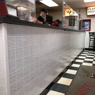 a man sitting at a counter