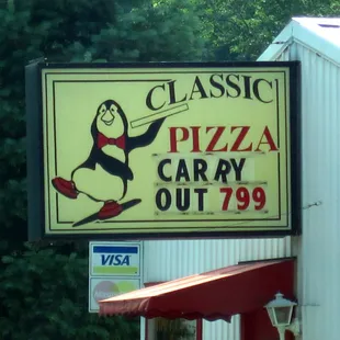 a sign for classic pizza carry out 799