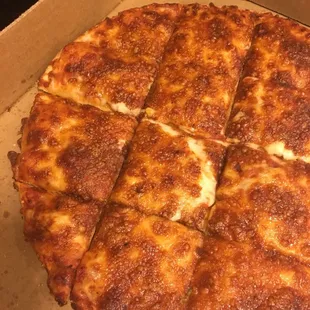 Tasteless, burnt cheese pizza. This is acceptable to serve to a customer?