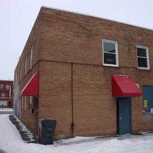 Back of the building -- back door and off-street parking, view looking southwest.