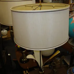 A pair of 1950s cattail lamps with light-up flowers in the brass flute flowers on the base!