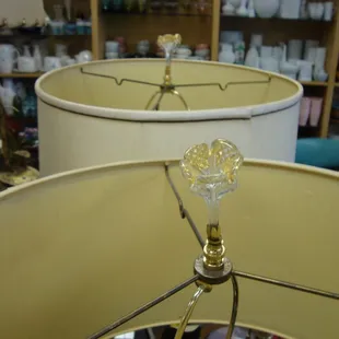 Glass (or crystal) flower finials on the pair of 1950s cattail lamps!