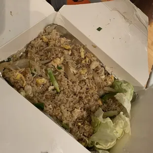 a box of fried rice and lettuce