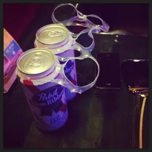 a pair of sunglasses and a can of beer