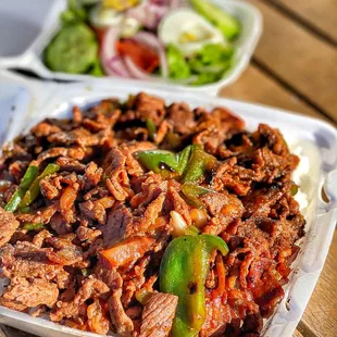 a plate of meat and vegetables