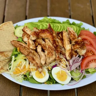 a plate of food on a wooden table