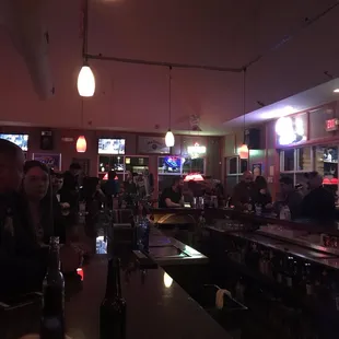 eople sitting at the bar