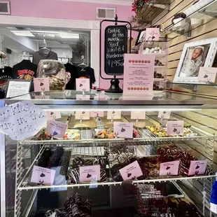 a variety of donuts in a display case