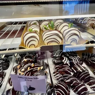 a variety of pastries in a display case