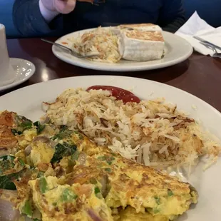 Veggie omelet and healthy breakfast burrito