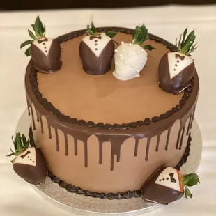 a chocolate cake decorated with strawberries